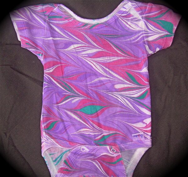 Marbled onesie in purple pink green feather design