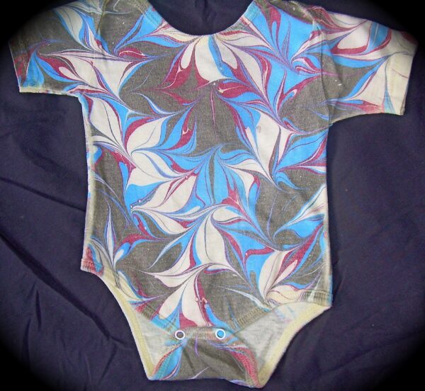 Onesie with freeform blue red black design