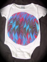 Onesie with circle motif with feather design in blue black hot pink