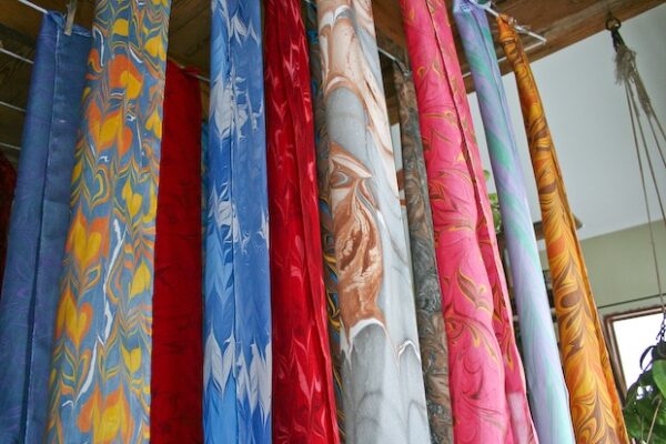 Marbled scarves hanging on a line